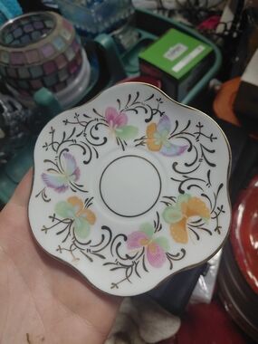 Formalities by Baum Bros. demitasse saucer featuring a colorful butterfly and fl